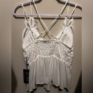 White crossed spaghetti strap top. Large. Never used. Tag still on.
